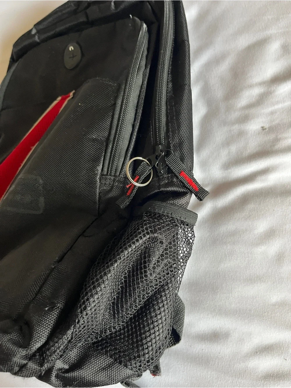 Black & Red Multi-Pocket Backpack with Media Port & Mesh Side Pockets